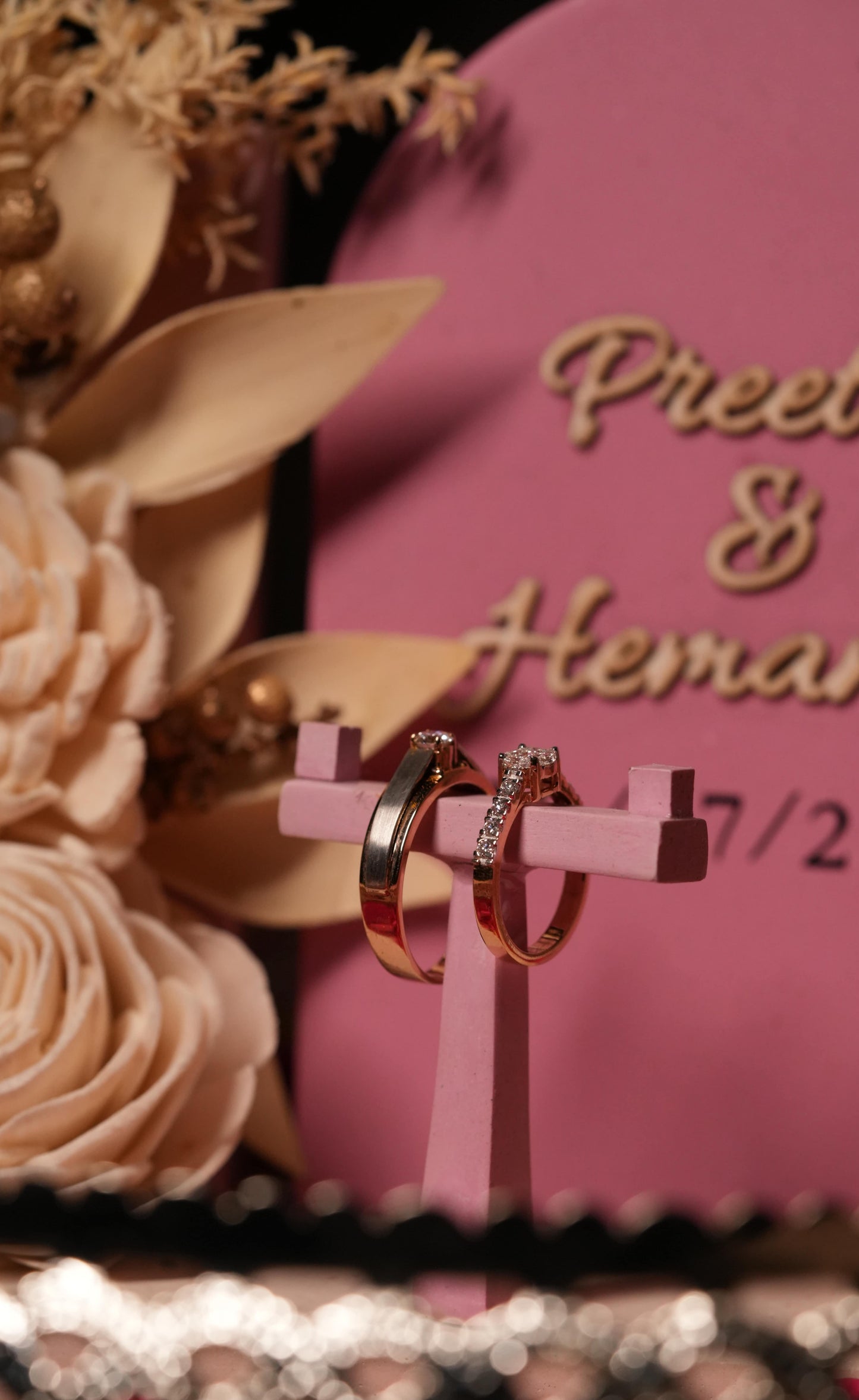 “Navya ring platter with two wedding rings and engraved names”