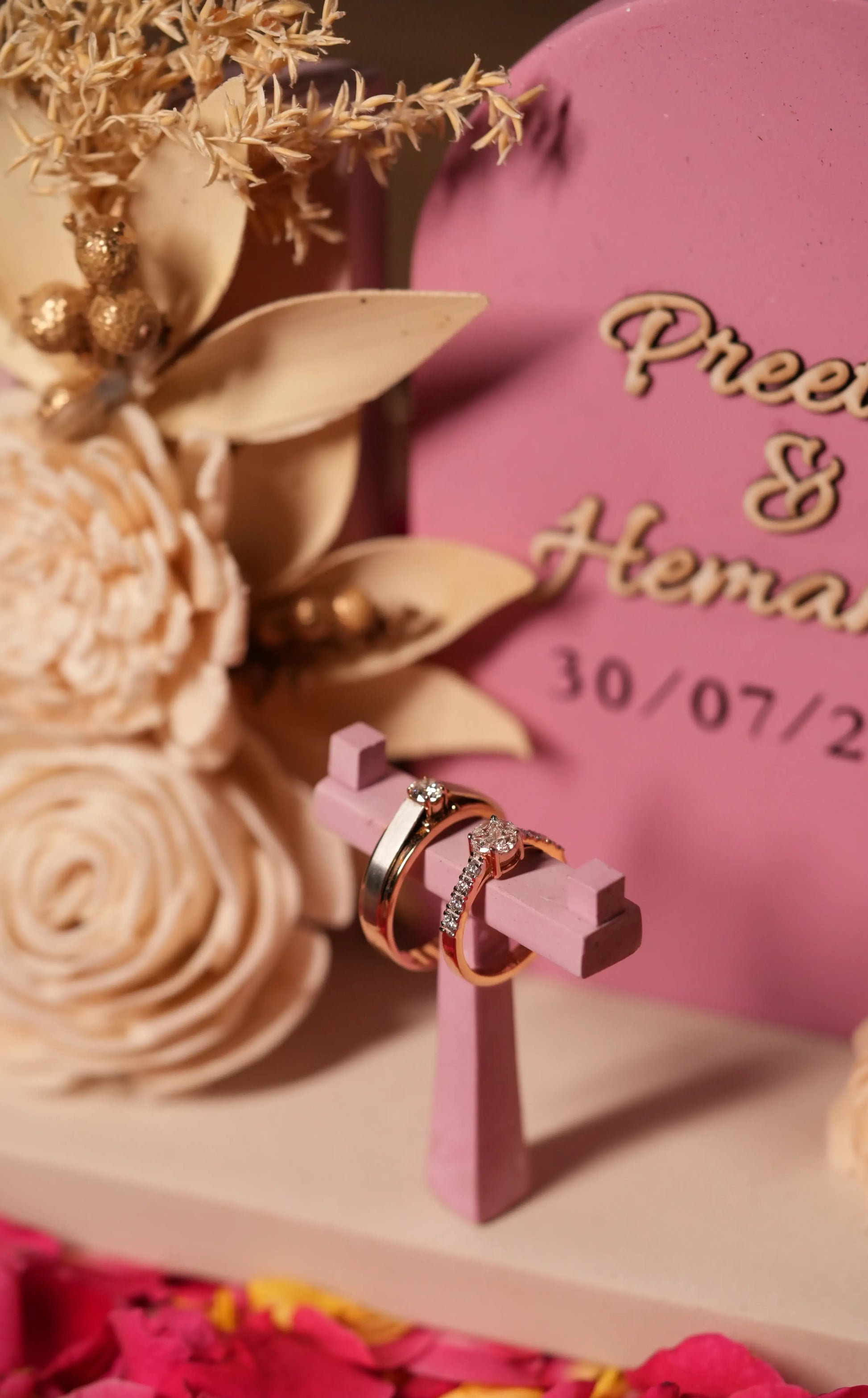 “Navya ring platter with two wedding rings and engraved names”